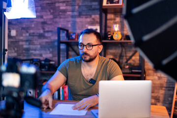 Male Video Narrator in Front of Camera Setup