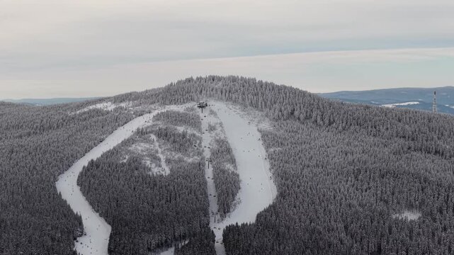 mountains in the snow ski slope drone shot