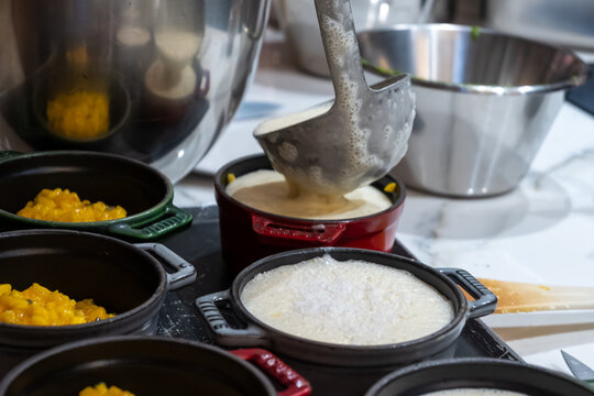 High cuisine cooking experince with chef in cook studio in Paris, preparation of different fine dishes with vegetables, truffle mushrooms, red bits, black salsify, nuts