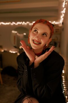 Moody low light portrait of a woman wearing black