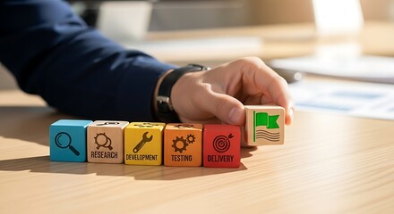 Businessman arranging colorful wooden blocks with icons representing business concepts and solutions on a wooden desk.