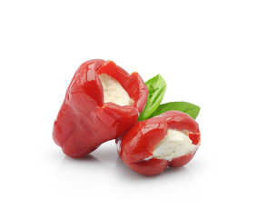 Picante small red bell pepper stuffed with cream cheese isolated on white background. Antipasto, mediterranean food.