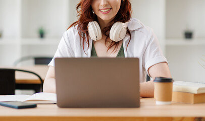Caucasian woman girl take work break at office relaxed businesswoman smile listen music in...
