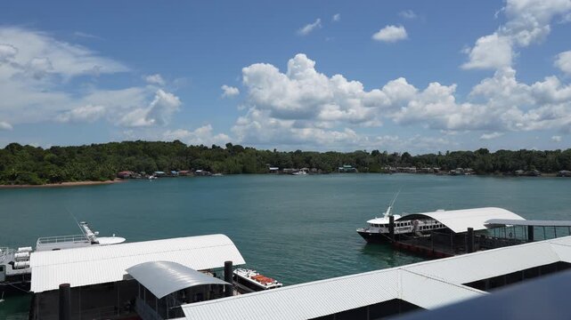 B roll of Oceanna Baruna Jaya ferry sailing between Tanjung Balai Karimun and Batam showing passenger transport across calm sea with coastal views and daily island connectivity