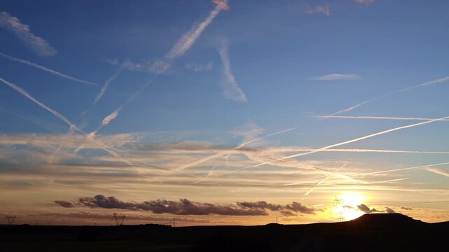 Unusual Aircraft Trails at Sunset, Geoengineering Debate Concept