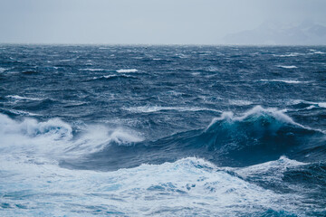 Naklejka premium Drake Passage Large Waves Crashing in Ocean Wide. Motion Frozen in Time. Fast Exciting Movement. Abstract Landscape Nature Antarctica