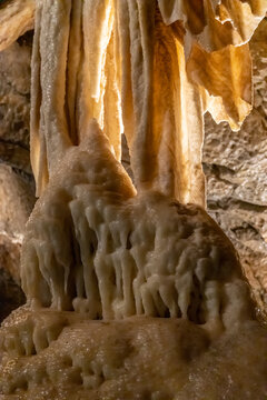 Punkva Cave interior in the Moravian Karst with limestone chambers, stalactites, stalagmites, and an underground river. Karst geology environment showing rock formations, subterranean landscape