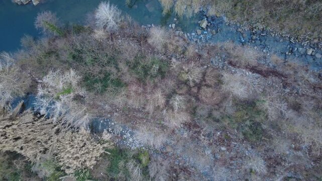 Drone captures aerial top view of Castellfollit de la Roca perched on rocky cliff.