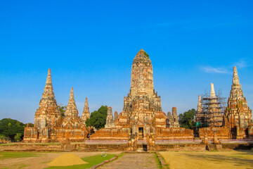Fototapeta premium Ayutthaya historical park in Thailand with ancient temple ruins, brick stupas, and archaeological structures. UNESCO World Heritage site showing cultural heritage, Buddhist architecture, historic city