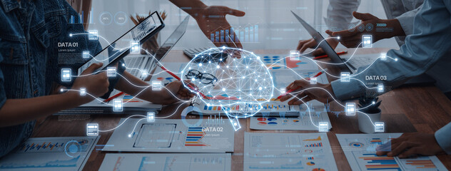 Team members engage in collaborative efforts in a modern office setting, incorporating technology and digital brain visualization to improve decision-making and data analysis. Trope