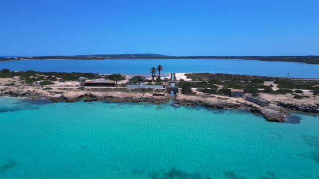 Formentera island landscape with beach bar, salt flats Perfect aerial view drone