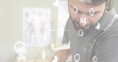 Leaning, male with short beard wearing grey polo studying holographic charts in clinic, copy space