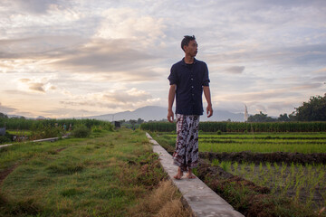 Mindful Meditation by a Javanese Youth Wearing a Batik Sarong