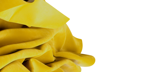 Close-up shot of yellow fabric with soft textures and folds. Perfect for backgrounds, textures and abstract design conce