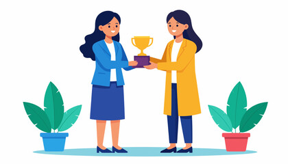 Two women exchanging a trophy in a professional setting with plants.