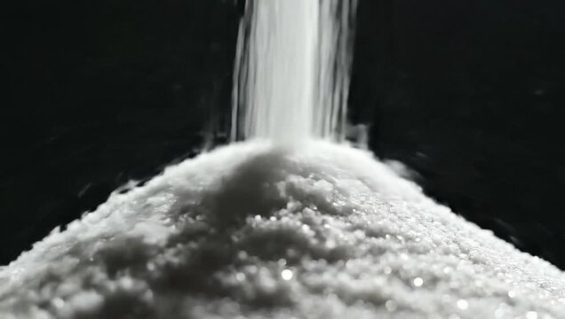 Pouring Powder into a White Mound Close Up.