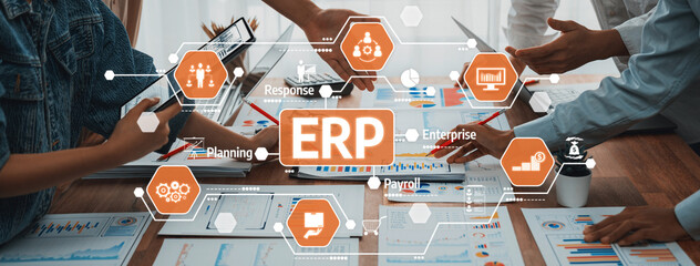 A dynamic office scene showcasing teamwork in strategic planning, featuring hands engaged with devices and ERP visualization tools to enhance organizational efficiency. Amity