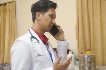 Male Doctor Engaged in a Professional Phone Conversation