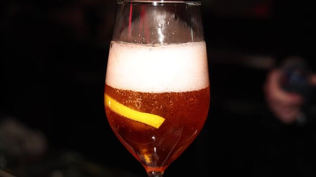 Bartender working, beautiful row line of different coloured liquor alcohol cocktails on a party in a bar, catering banquet on event, barman mixing drinks, selection of beverages in a restaurant club