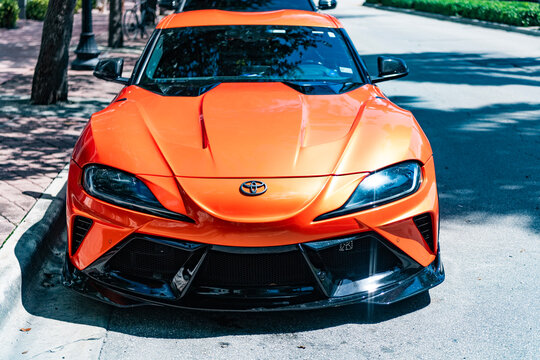 Miami, Florida, USA - July 06, 2025: 2024 Toyota Supra sport car. Luxury sportscar Toyota Supra. Car Toyota Supra parked outdoor. Orange car, corner view