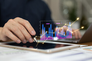 Business professional analyzing financial growth data with digital charts and rising performance graph on tablet. Investment analytics, revenue trend, business strategy, data visualization modern fina