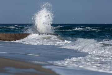 Sea waves breaking into foam