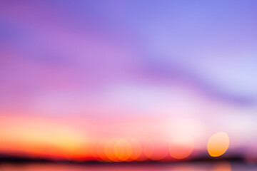 Abstract sunset bokeh background with purple and orange gradient sky,A beautiful abstract...