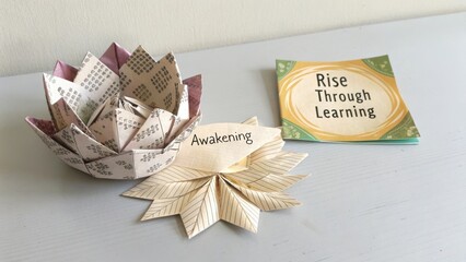 Artisanal Paper Crafts Featuring Intricate Lotus and Leaves with Inspirational Message about Learning and Growth