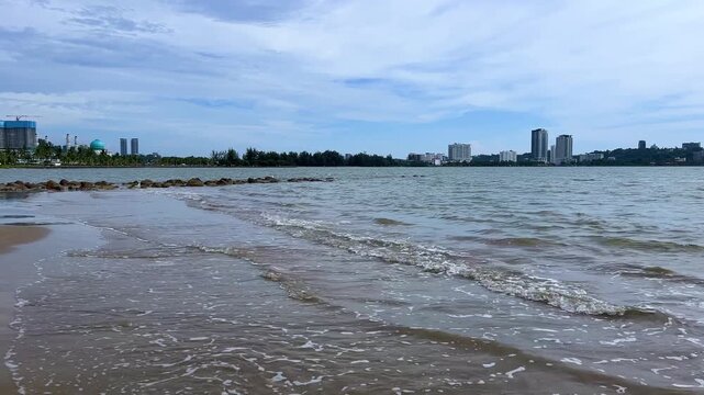Malaysia, June 31, 2025: The Masjid Bandaraya City Mosque in Kota Kinabalu, Sabah. View of the floating mosque from Likas Bay Beach on the South China Sea. 4K