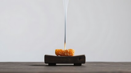 tolerable. Raw frankincense resin burning on dark wood, thin gray smoke rising. event programs, museum guides, designed for cultural heritage projects and event programs, used by interior designers.