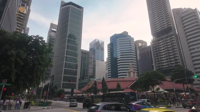 Twilight of Lau Pa Sat, or Telok Ayer Market, is a historic landmark in Singapore's Central Business District. 4K resolution video of Singapore skyline.