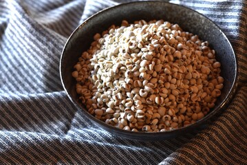 Job's tears in black bowl-Healthy food.