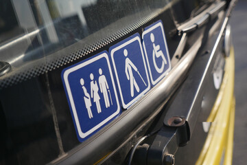 Signs for accessibility and gender on a bus © Towfiqu Barbhuiya 