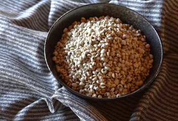 Job's tears in black bowl-Healthy food.