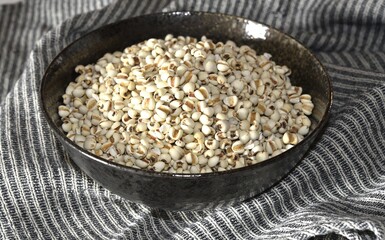 Job's tears in black bowl-Healthy food.