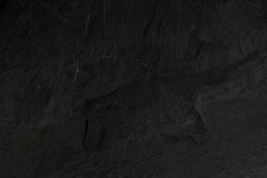Dark grey black slate background or texture. black stone