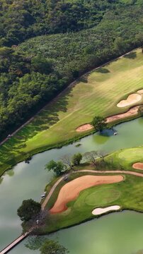 Aerial View of Tropical Golf Course with Lake and Sand Bunkers