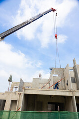 Background banner. Large cranes moving prefabricated walls in factories. Prefabricated concrete walls for building office buildings and residential houses. reinforced concrete wall