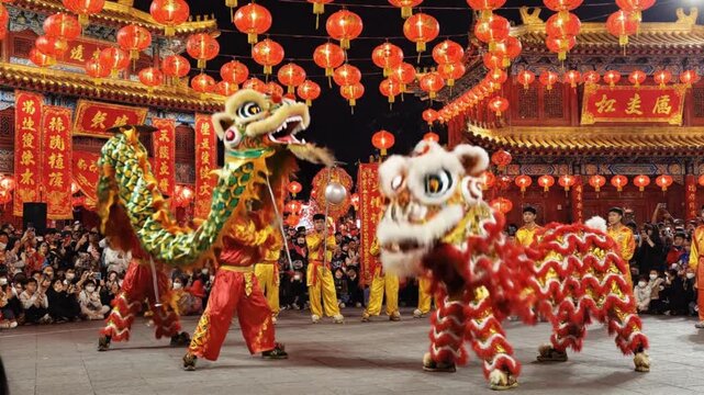 Cultural performers dancing dragon and lion dance at traditional Chinese festival with spectators and lanterns