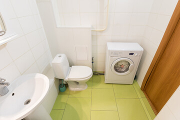 modern bathroom room with toilet and washing machine