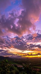 Vivid sunset dyes the horizon in a landscape