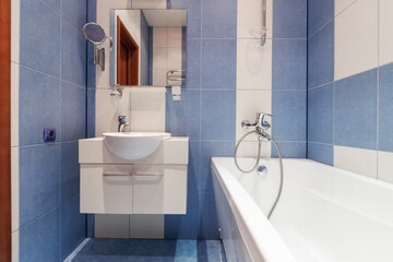 modern bathroom room with toilet and washing machine
