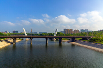 Fototapeta premium Urban River Bridge Reservoir And Highrise Buildings