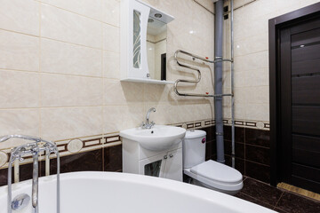 modern bathroom room with toilet and washing machine
