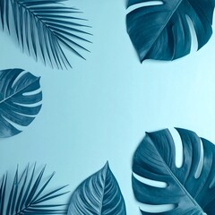 Blue-toned image featuring tropical leaves arranged around a central space on a light blue background