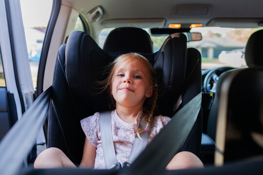 Thee year old child in extended rear facing car seat in family car
