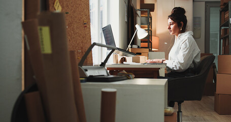 Ecommerce, woman and browsing in office with laptop for online order, process sales or shipping...