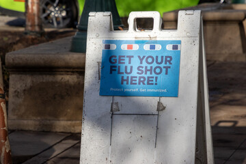 A sign advertising flu shot