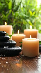 Soft glow from candles, smooth stones, and bamboo leaves