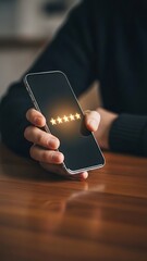 Person holding smartphone displaying glowing stars technology interaction concept